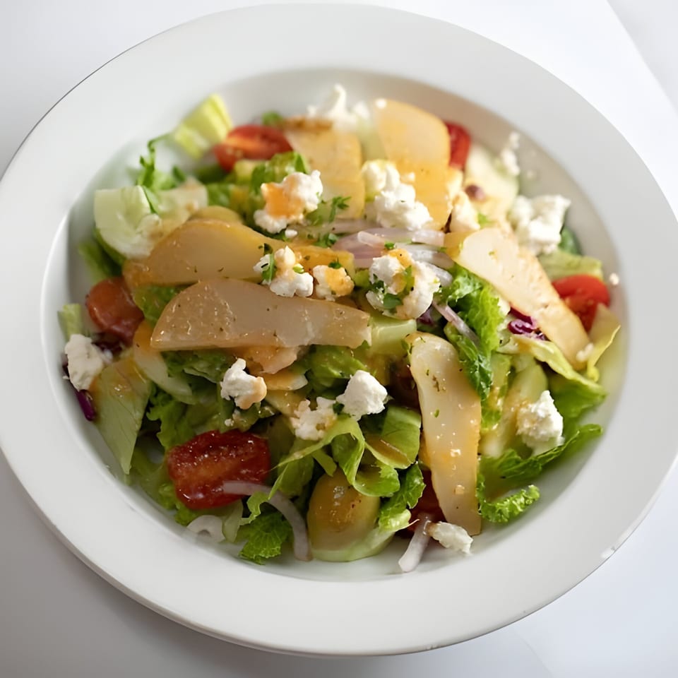 Rosario's Trattoria & Pizzeria's fresh Italian salad with lettuce, tomatoes, cheese, and pear slices.
