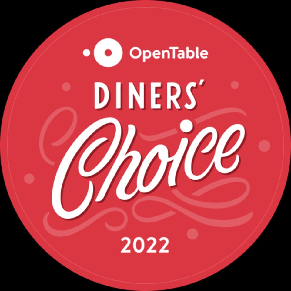 Red circular OpenTable Diners' Choice 2022 award logo with white text.