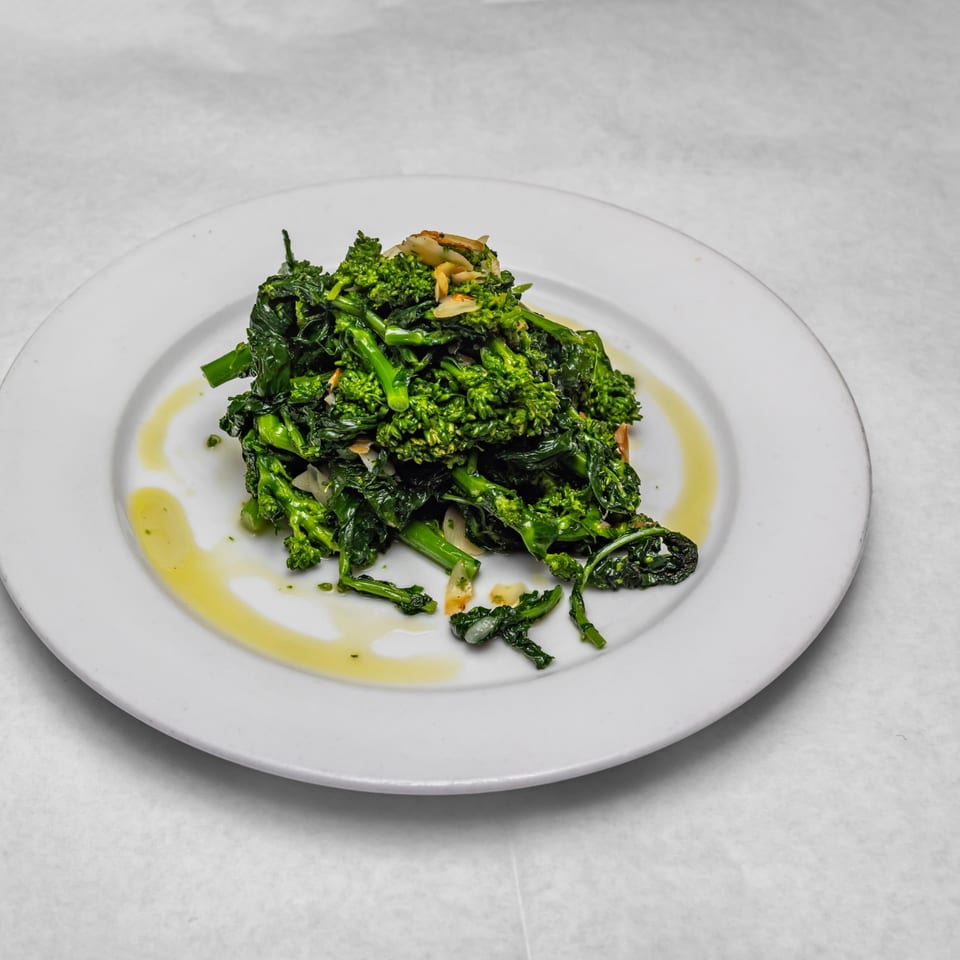 Broccoli rabe with garlic and olive oil, a classic Italian side dish from Rosario's Trattoria.
