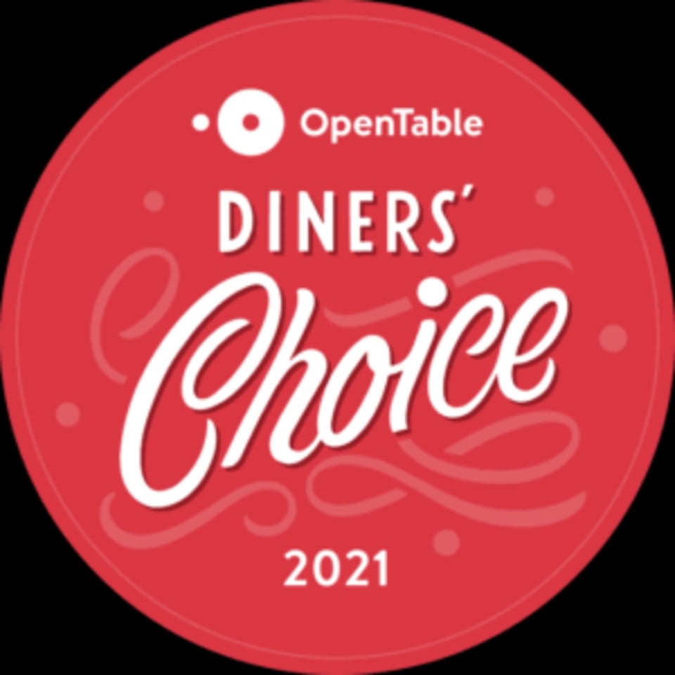 Red circular OpenTable Diners' Choice 2021 award badge with white text.