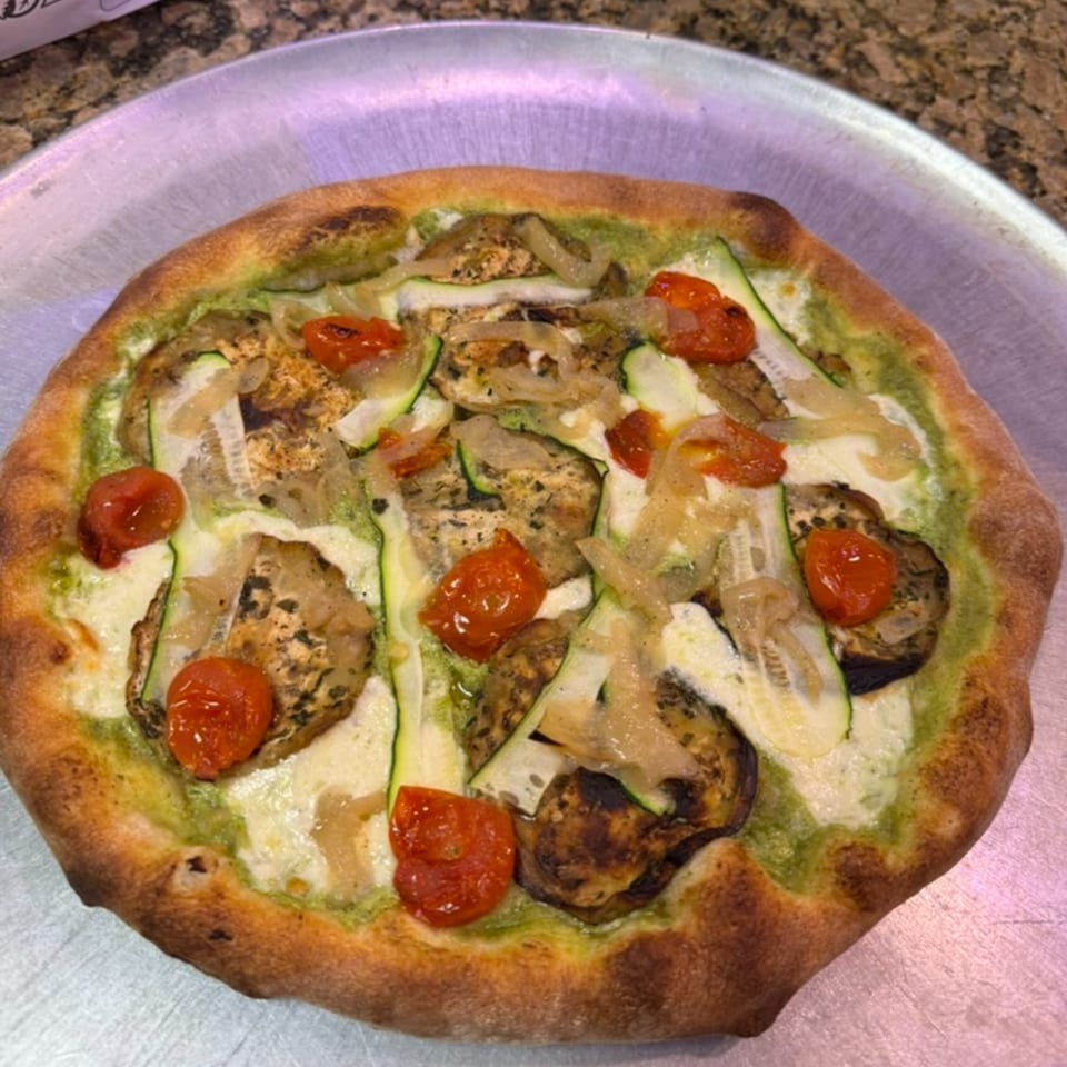 Rosario's Trattoria & Pizzeria's vegetable pizza with zucchini, eggplant, tomatoes, and onions.